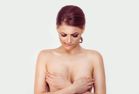 Woman preparing for therapeutic breast massage in lactation.