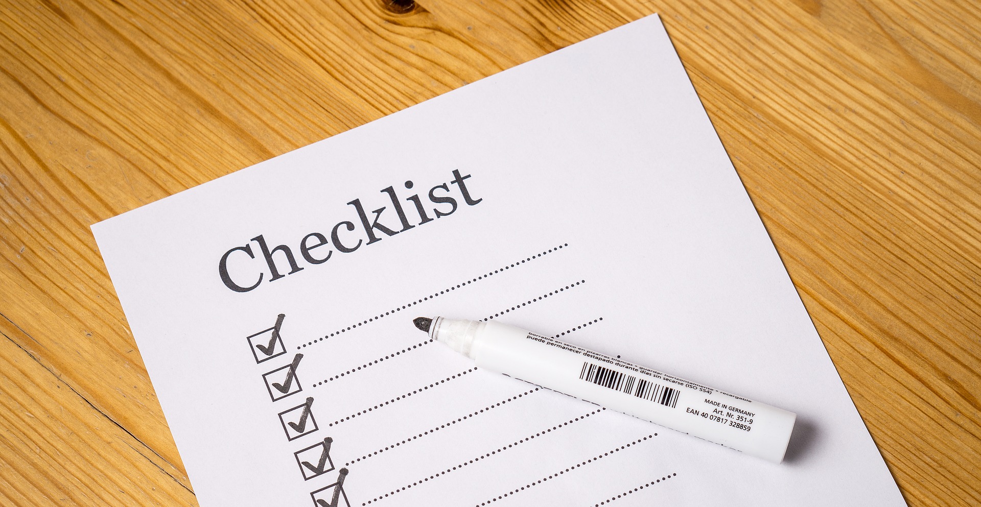 Checklist and pen. Making a checklist for your IBLCE Exam application helps plan ahead.