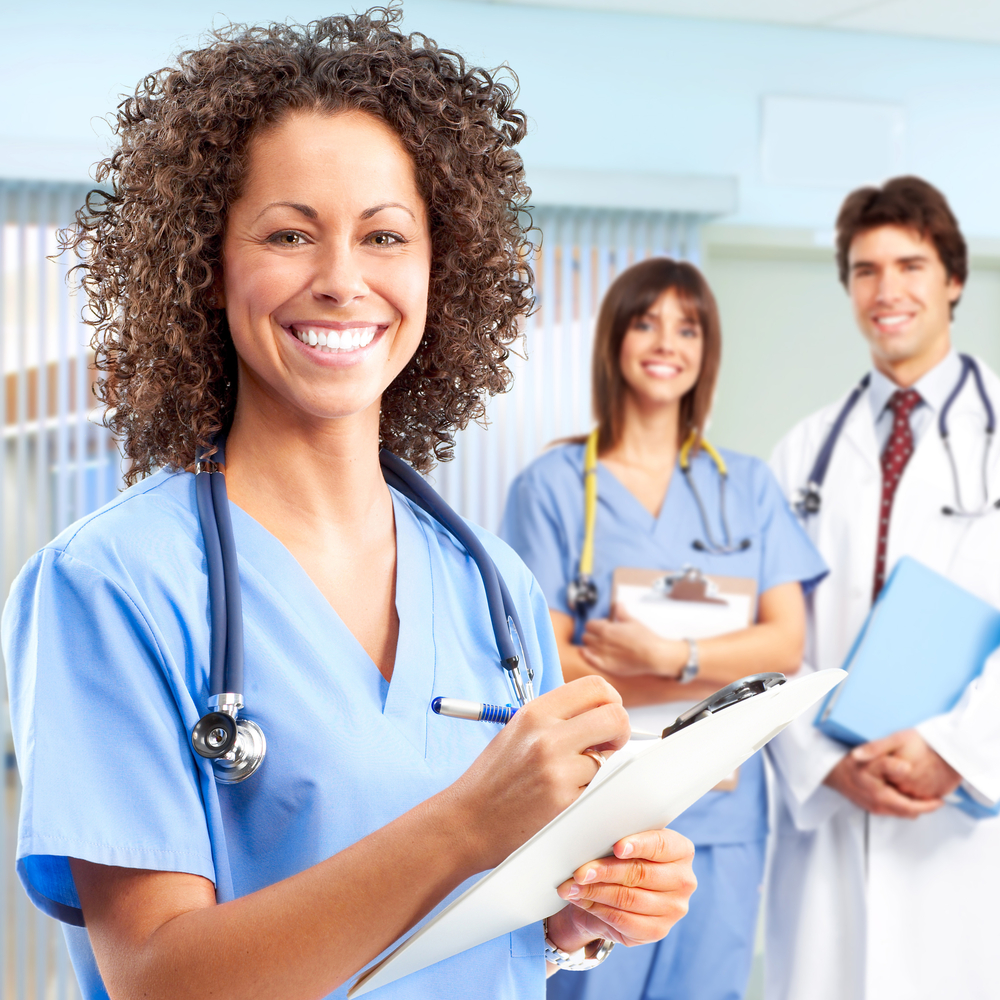 Hospital workers smiling about effectively communicating breastfeeding policy.