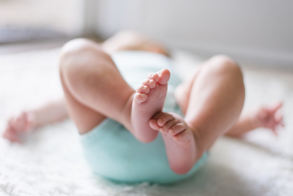 Baby in green diaper