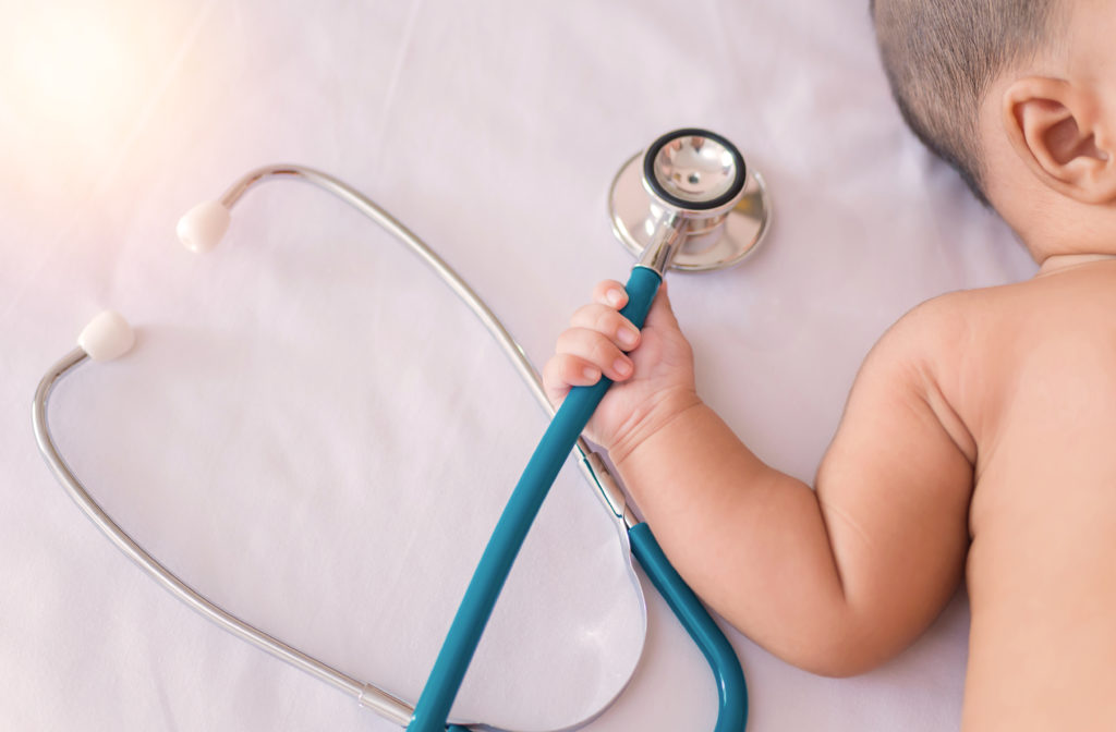 Baby at doctor visit with stethoscope