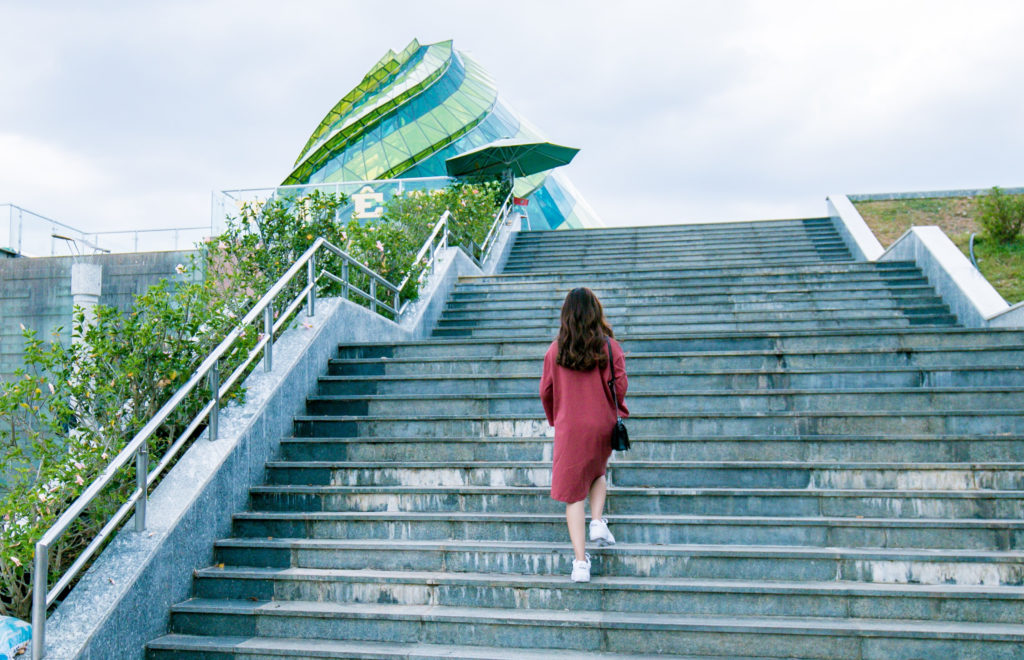 Woman in red dress on steps