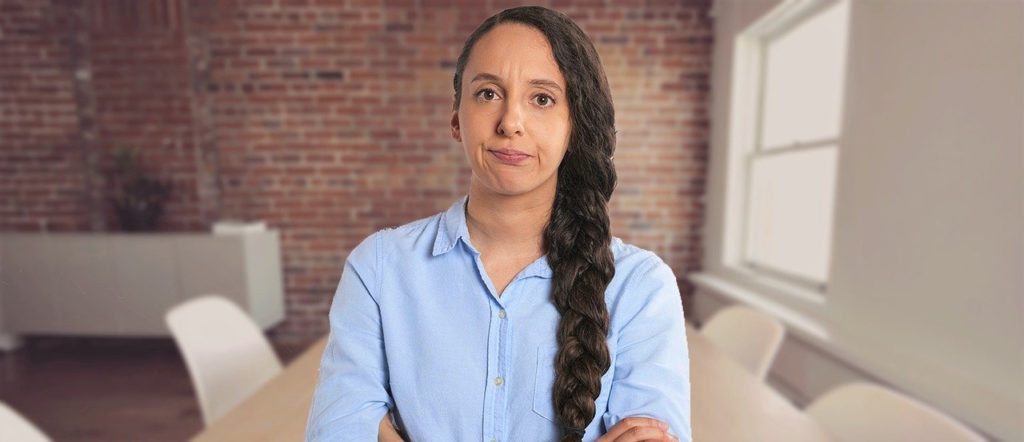 Annoyed woman in a blue shirt.