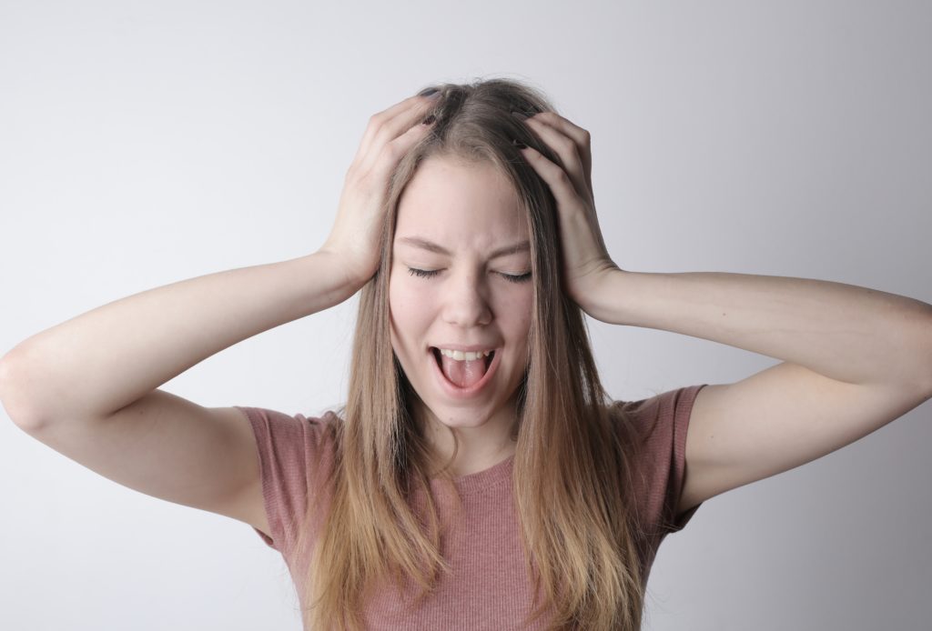 Woman overwhelmed from test anxiety.