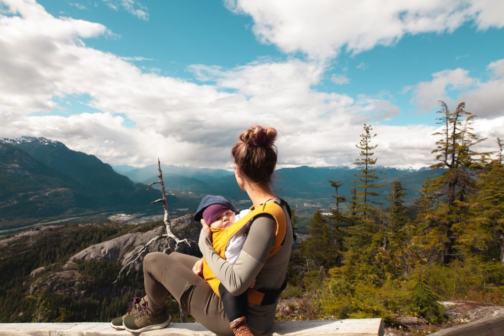 Woman babywearing on mountain