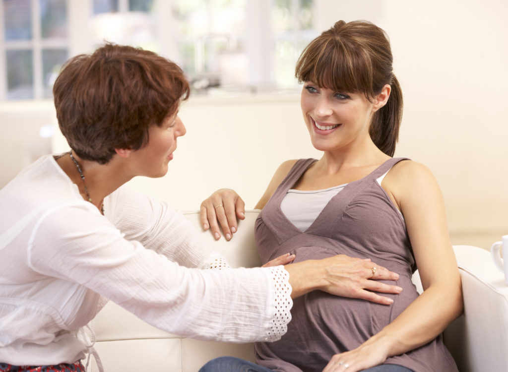 Celebrating Midwifery Week! Midwife assisting expectant mother.