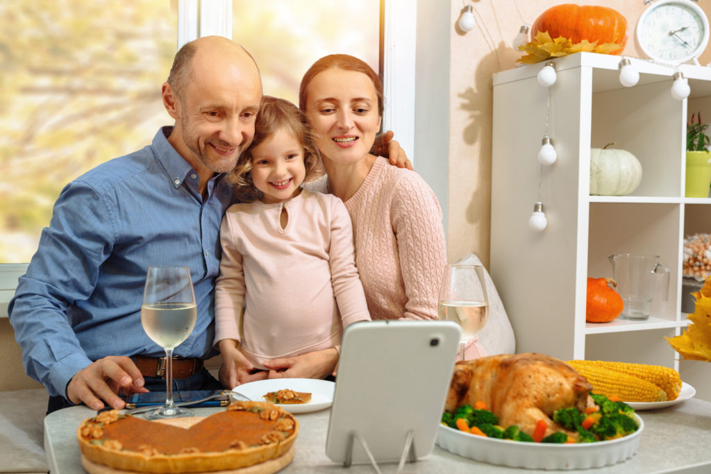 Family celebrating Thanksgiving virtually