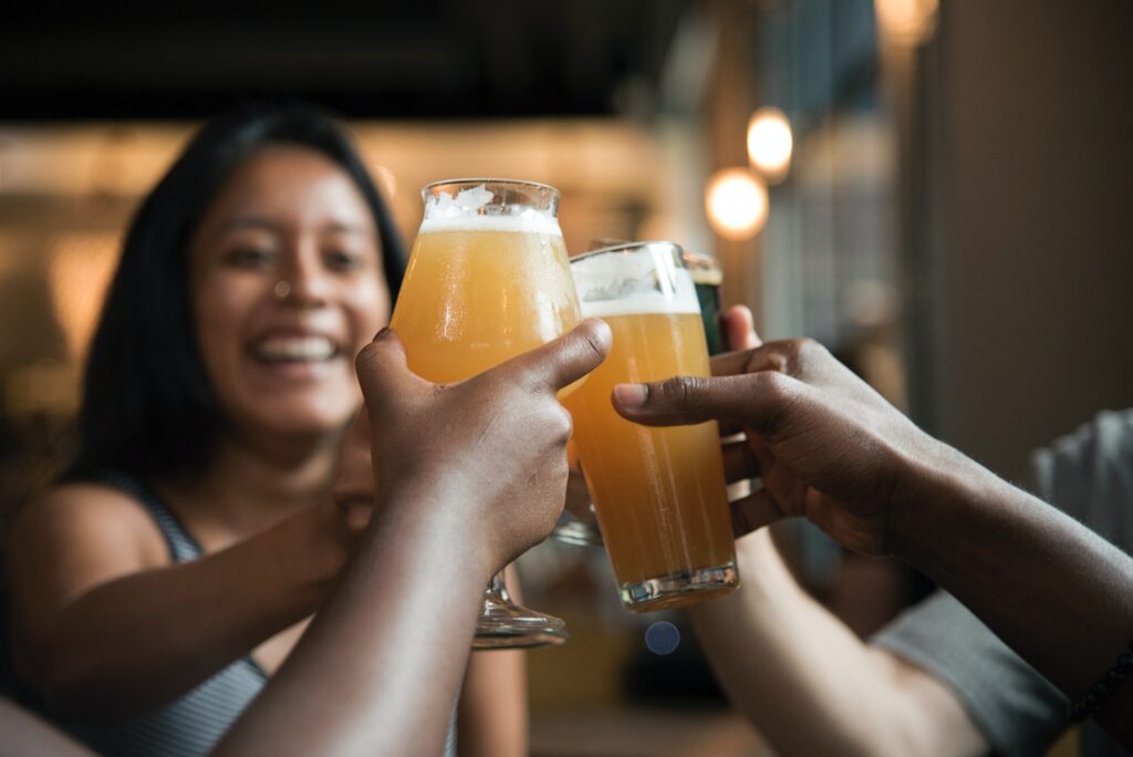 Friends raising glasses of beer