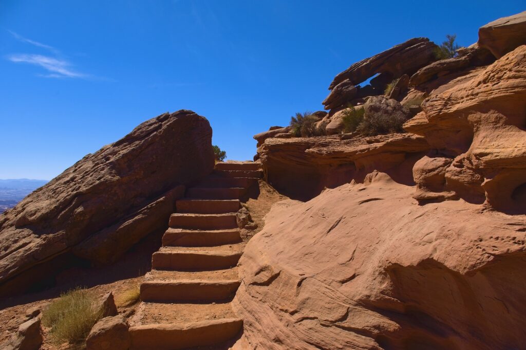 Steps carved in red rocks going upward. 