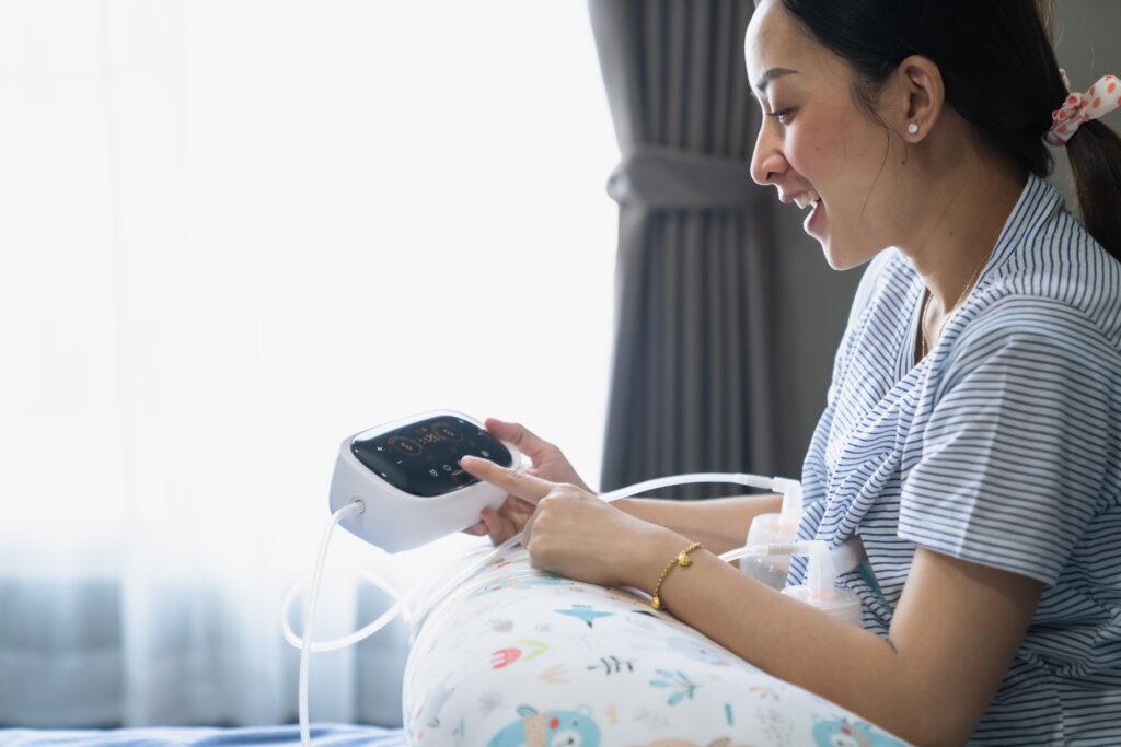 Woman using a breast pump.