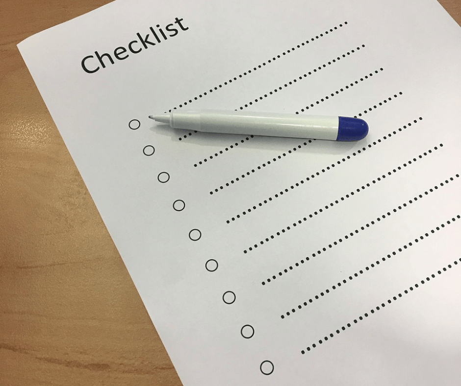 Checklist on table with a pen.